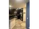 Spacious kitchen featuring stainless steel appliances, granite countertops, and dark wood cabinetry at 5350 E Deer Valley Dr # 3267, Phoenix, AZ 85054