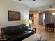 Living room featuring hardwood floors, a leather couch, and an open concept layout at 5350 E Deer Valley Dr # 3267, Phoenix, AZ 85054