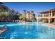 Inviting community pool with ample seating and palm trees at 5350 E Deer Valley Dr # 3267, Phoenix, AZ 85054