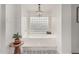 Bright bathroom featuring a chandelier over a soaking tub with decorative tile floor at 5602 W Alameda Rd, Glendale, AZ 85310