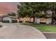 Beautiful home featuring a circular driveway, mature trees and meticulous landscaping at 5602 W Alameda Rd, Glendale, AZ 85310