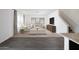 Open-concept living room boasts neutral décor, plush seating, and seamlessly connects to kitchen space at 5824 W Willow Ridge Dr, Laveen, AZ 85339