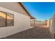 Side view of home with gravel backyard and covered patio at 6244 E Inglewood St, Mesa, AZ 85205