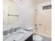 Bathroom with a marble vanity top, round mirror, and shower at 6244 E Inglewood St, Mesa, AZ 85205