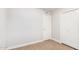 Bright bedroom featuring wood-look flooring and closet for storage at 6244 E Inglewood St, Mesa, AZ 85205