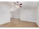 Spacious living room featuring a ceiling fan and modern light-colored flooring at 6244 E Inglewood St, Mesa, AZ 85205