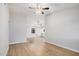 Spacious living room with vinyl flooring, ceiling fan and view of the kitchen at 6244 E Inglewood St, Mesa, AZ 85205