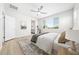 Serene bedroom featuring light walls, plush bedding, large window, and stylish decor, creating a peaceful retreat at 651 W Laredo St, Chandler, AZ 85225