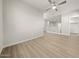 Spacious bedroom with wood-look floors, neutral walls, and a ceiling fan at 651 W Laredo St, Chandler, AZ 85225
