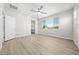 Bright bedroom features wood-look floors, a ceiling fan, and natural light at 651 W Laredo St, Chandler, AZ 85225