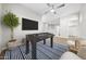 Entertainment space with foosball table, mounted TV, and blue striped rug, perfect for leisure and relaxation at 651 W Laredo St, Chandler, AZ 85225