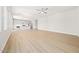 Open-concept living space with wood-look floors, neutral walls, and a ceiling fan at 651 W Laredo St, Chandler, AZ 85225