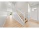 Bright foyer features wood-look floors, a white staircase, and natural light from the backyard at 651 W Laredo St, Chandler, AZ 85225