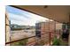 Balcony overlooking the neighborhood and nearby building with great views and greenery, with an outdoor seating area at 7157 E Rancho Vista Dr # 5004, Scottsdale, AZ 85251