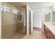 Beautiful bathroom with walk-in shower, hardwood floors, and vanity with countertop at 7157 E Rancho Vista Dr # 5004, Scottsdale, AZ 85251
