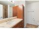 Bathroom features a granite countertop vanity, updated fixtures, and wood cabinetry with a shower and commode at 7157 E Rancho Vista Dr # 5004, Scottsdale, AZ 85251