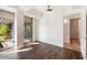 Bedroom with hardwood floors, large windows, and access to private outdoor area at 7157 E Rancho Vista Dr # 5004, Scottsdale, AZ 85251