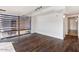 Bedroom with hardwood floors, closet, and expansive windows overlooking city views at 7157 E Rancho Vista Dr # 5004, Scottsdale, AZ 85251