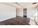 Bedroom with hardwood floors, closet, and expansive windows overlooking city views at 7157 E Rancho Vista Dr # 5004, Scottsdale, AZ 85251