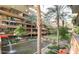 Beautiful courtyard with lush greenery, a tranquil water feature, and comfortable seating areas for relaxation at 7157 E Rancho Vista Dr # 5004, Scottsdale, AZ 85251