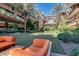 Inviting courtyard featuring a green space, mature palm trees, and comfortable outdoor seating areas at 7157 E Rancho Vista Dr # 5004, Scottsdale, AZ 85251