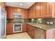 Updated kitchen featuring stainless steel appliances, granite countertops, and ample cabinet space at 7157 E Rancho Vista Dr # 5004, Scottsdale, AZ 85251