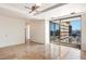 Open living space featuring neutral walls, tile floors, and sliding glass doors to the balcony at 7157 E Rancho Vista Dr # 5004, Scottsdale, AZ 85251