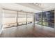 Bright living room with floor-to-ceiling windows and modern roller shades at 7157 E Rancho Vista Dr # 5004, Scottsdale, AZ 85251