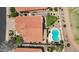 Aerial view of a house with a backyard pool, lush greenery, and a well-maintained roof at 7464 E Lompoc Ave, Mesa, AZ 85209