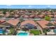 Aerial view of the backyard with a private pool, neat landscaping, and covered patio in a desirable neighborhood at 7464 E Lompoc Ave, Mesa, AZ 85209