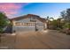 Well-maintained home with a spacious three-car garage and a lovely desert landscape at 7464 E Lompoc Ave, Mesa, AZ 85209