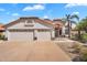 Charming home featuring a spacious two-car garage and beautifully maintained desert landscaping at 7464 E Lompoc Ave, Mesa, AZ 85209