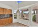Bright kitchen nook offers tranquil backyard views, great cabinet storage, and inviting natural light at 7464 E Lompoc Ave, Mesa, AZ 85209