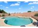 Backyard pool showcasing pebble-tec pool and decorative patio at 7464 E Lompoc Ave, Mesa, AZ 85209
