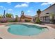 Sparkling backyard pool surrounded by lush landscaping and a spacious patio at 7464 E Lompoc Ave, Mesa, AZ 85209
