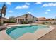 Inviting backyard with a beautiful pool, covered patio, and meticulous landscaping provides the perfect space for relaxing at 7464 E Lompoc Ave, Mesa, AZ 85209