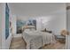 Inviting bedroom with wood-look floors and a serene forest mural on the wall at 7625 E Camelback Rd # B244, Scottsdale, AZ 85251