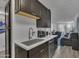 Remodeled kitchen with stainless steel appliances, shaker cabinets, and white countertops at 7625 E Camelback Rd # B244, Scottsdale, AZ 85251