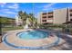 Relaxing community hot tub surrounded by ample seating and lush landscaping at 7625 E Camelback Rd # B244, Scottsdale, AZ 85251