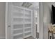 Ample storage with adjustable shelves in a well-lit, organized hallway at 7625 E Camelback Rd # B244, Scottsdale, AZ 85251