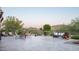 Beautiful backyard with tiled patio, comfortable seating, fire pit, and lush desert landscaping at 7753 E Whisper Rock Trl, Scottsdale, AZ 85266