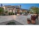 Expansive backyard featuring a covered patio, outdoor seating, barbecue, and beautiful desert landscaping at 7753 E Whisper Rock Trl, Scottsdale, AZ 85266