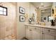 Bathroom featuring a large mirror, granite counters, decorative tile flooring, and a walk-in shower at 7753 E Whisper Rock Trl, Scottsdale, AZ 85266