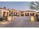 Beautifully landscaped property featuring a red tile roof, stucco exterior, and a spacious driveway at 7753 E Whisper Rock Trl, Scottsdale, AZ 85266
