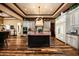 Gourmet kitchen featuring a large island, custom cabinetry, and high-end appliances in an elegant home at 7753 E Whisper Rock Trl, Scottsdale, AZ 85266