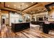 Gourmet kitchen featuring a large island, custom cabinetry, and high-end appliances in an elegant home at 7753 E Whisper Rock Trl, Scottsdale, AZ 85266