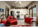 Kitchen and sitting area featuring stainless steel appliances, a breakfast table and red chairs at 7753 E Whisper Rock Trl, Scottsdale, AZ 85266