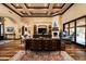 Elegant living room featuring custom ceiling details, a fireplace, hardwood floors, and designer furnishings at 7753 E Whisper Rock Trl, Scottsdale, AZ 85266
