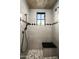 Modern shower with gray tile, black hardware, and a built-in bench for comfort and convenience at 7753 E Whisper Rock Trl, Scottsdale, AZ 85266