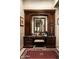 Bathroom vanity with a marble countertop, custom wood cabinets, and a large mirror at 7753 E Whisper Rock Trl, Scottsdale, AZ 85266